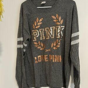 PINK body 100% cotton mesh in arms is 100% polyester size L rose gold lettering